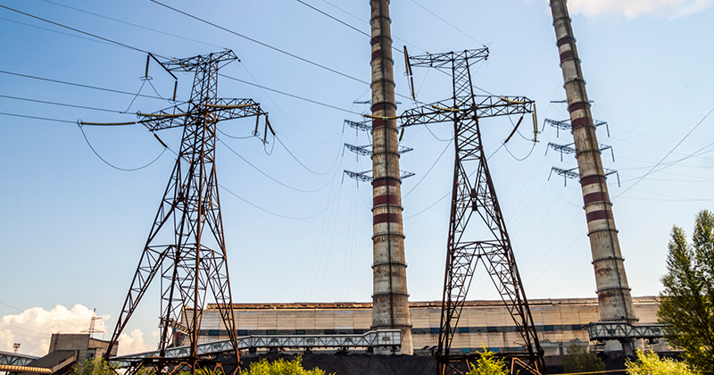 Coal towers and transmission lines_Canva.png