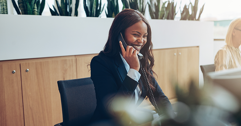 female business woman talking on phone_Canva.png