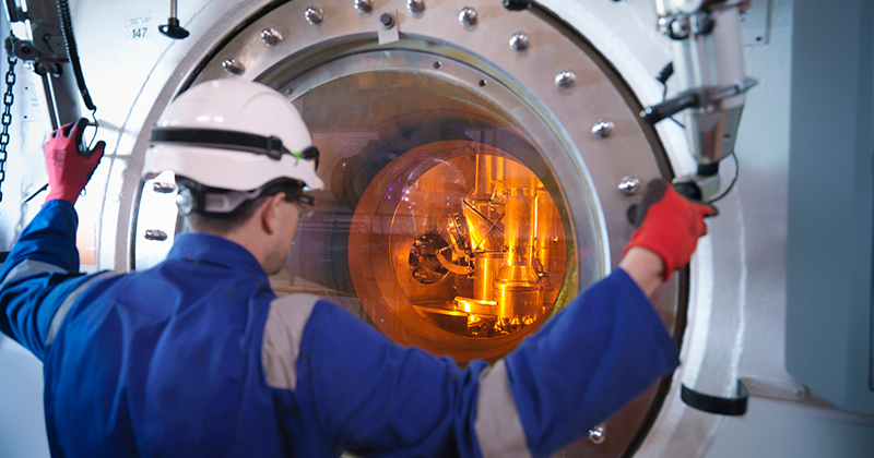 engineer handling hot rod in Nuclear plant_Canva.png