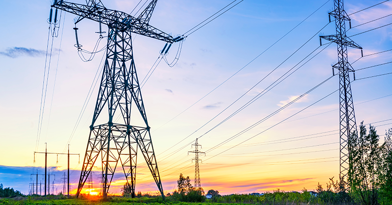 Industrial landscape with high voltage power lines_AdobeStock_352436024.jpeg